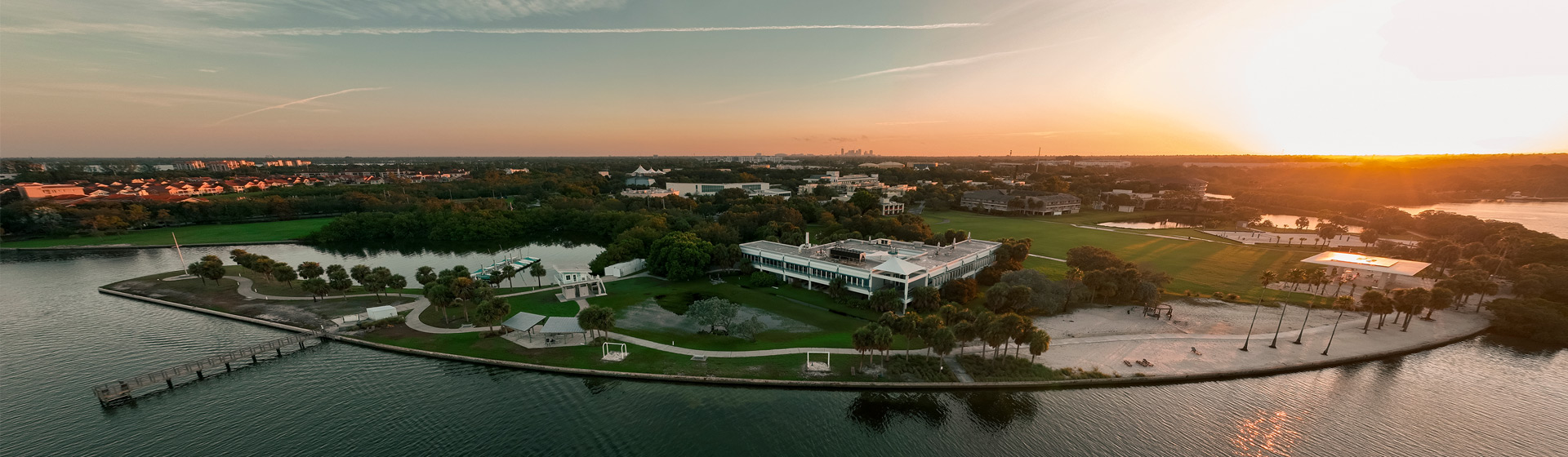 Aerial view of campus along the water