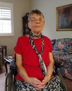 Sue in wheelchair, at home
