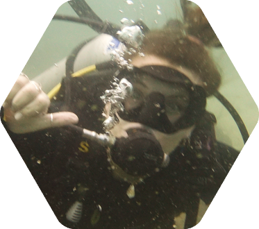 Scuba diver underwater giving a thumbs-up