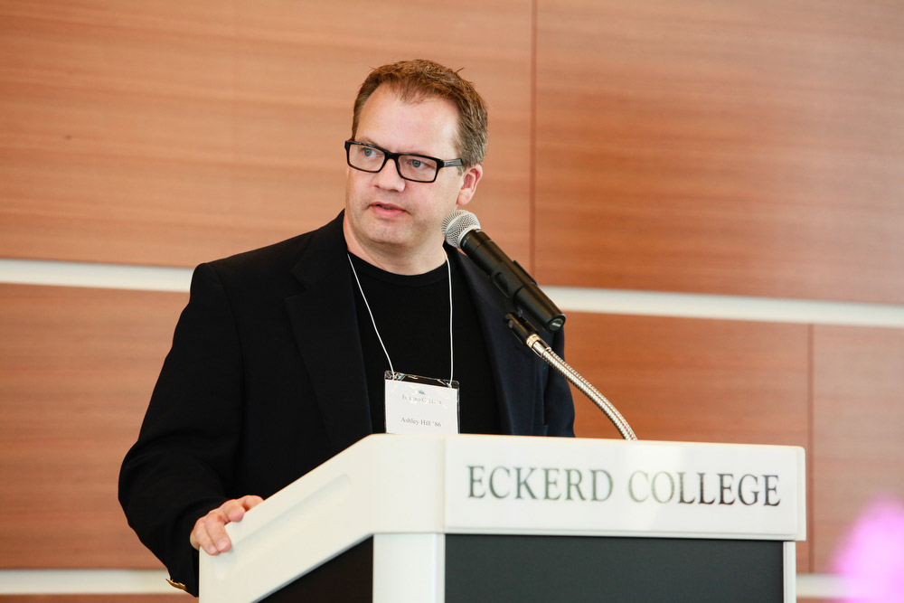 Hill standing at podium