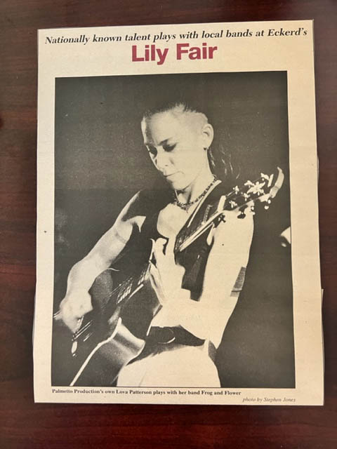 Newspaper clipping of guitar player