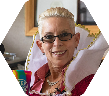 Lova Patterson holding a "Keep Eckerd Weird" mug