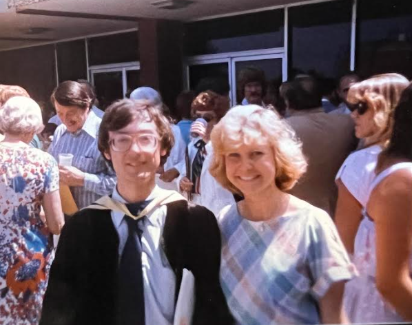 Karin standing shoulder to shoulder with young professor