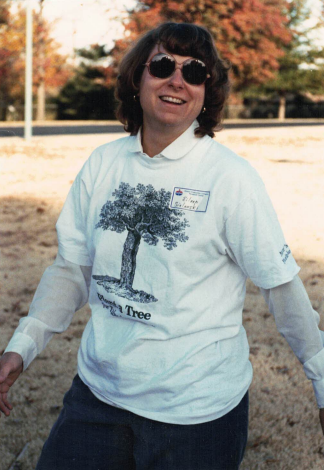 Woman in shirt with a tree on it