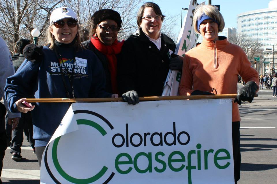 Group of women holding a sign that reads "Colorado Ceasefire"