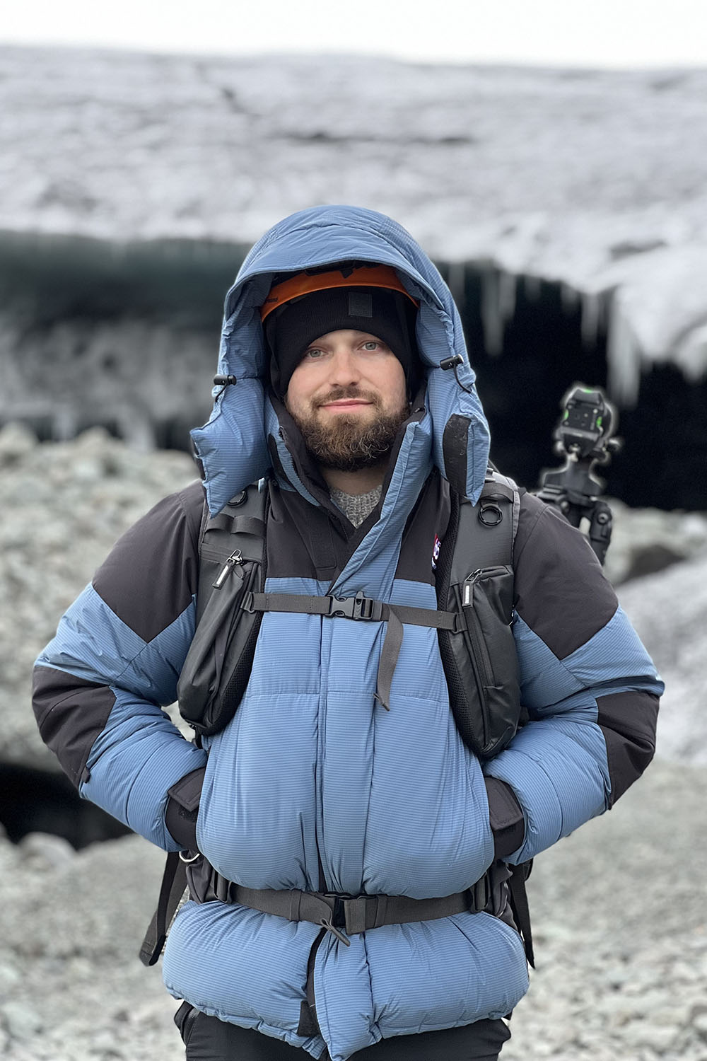 Man in puffy parka standing outdoors