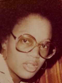 Vintage photo of a young woman in large glasses