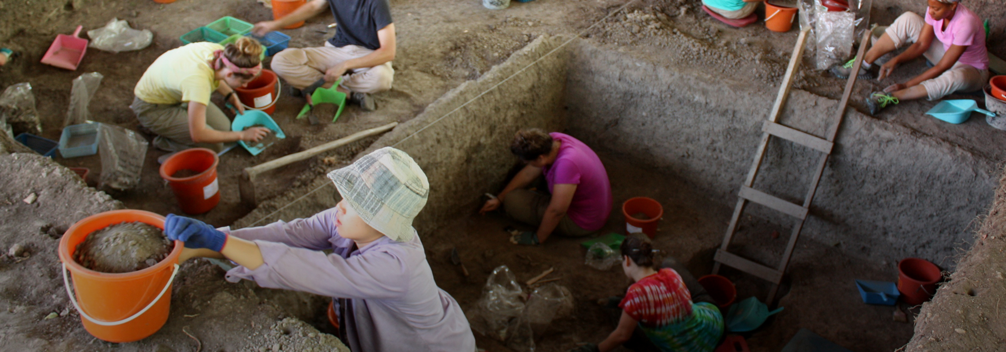Students working in an excavation unit in Lopburi, Thailand