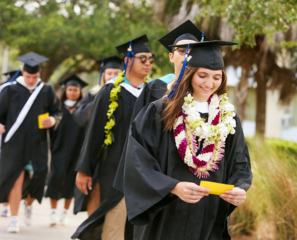 Eckerd graduates walking along pathway