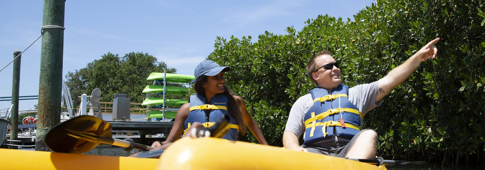 Economics professor Felardo with student in kayaks