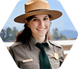 Young woman in park ranger hat and shirt