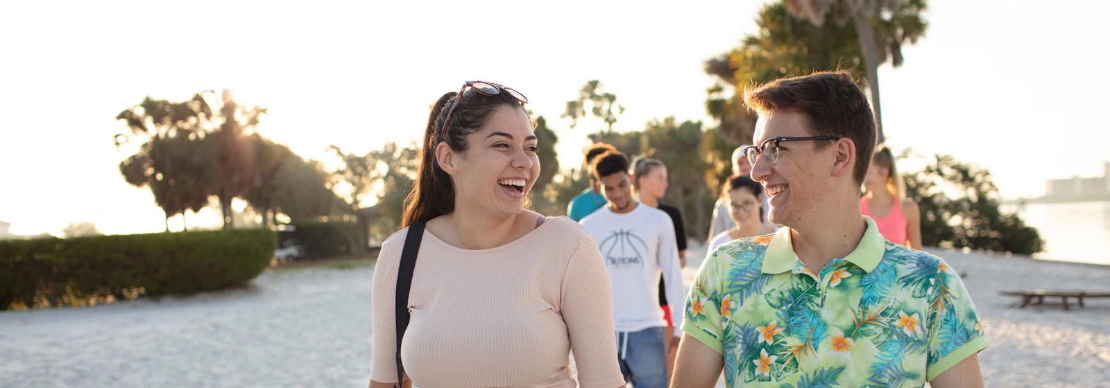 Students walking along the beach