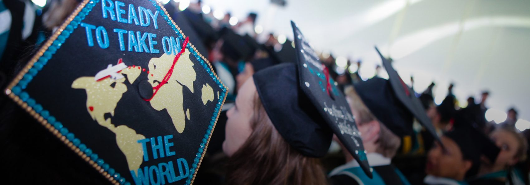 The graduation cap of a Creative Arts Collegium graduate that has been decorated to read "Ready to take on the world"