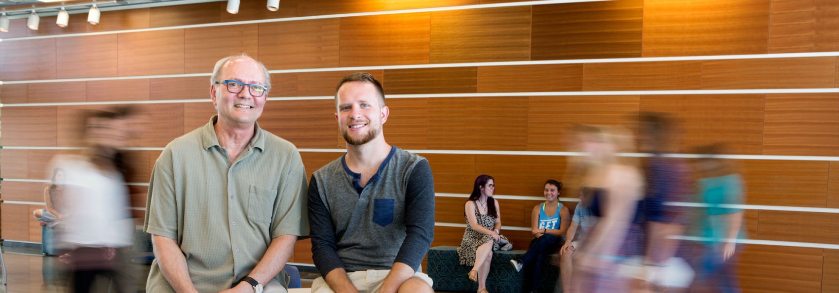 Greg Johnson '15 and Dr. William Felice sitting in James Center