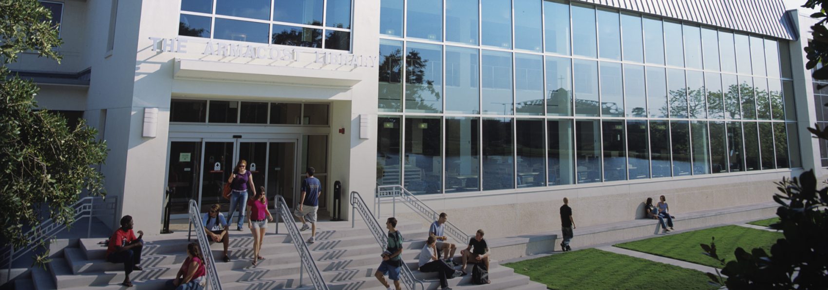 Outside of Armacost library with students walking around
