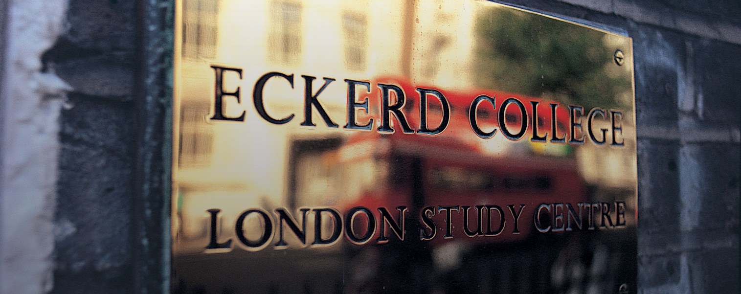 Eckerd College London Study Center sign with the reflection of a double-decker bus