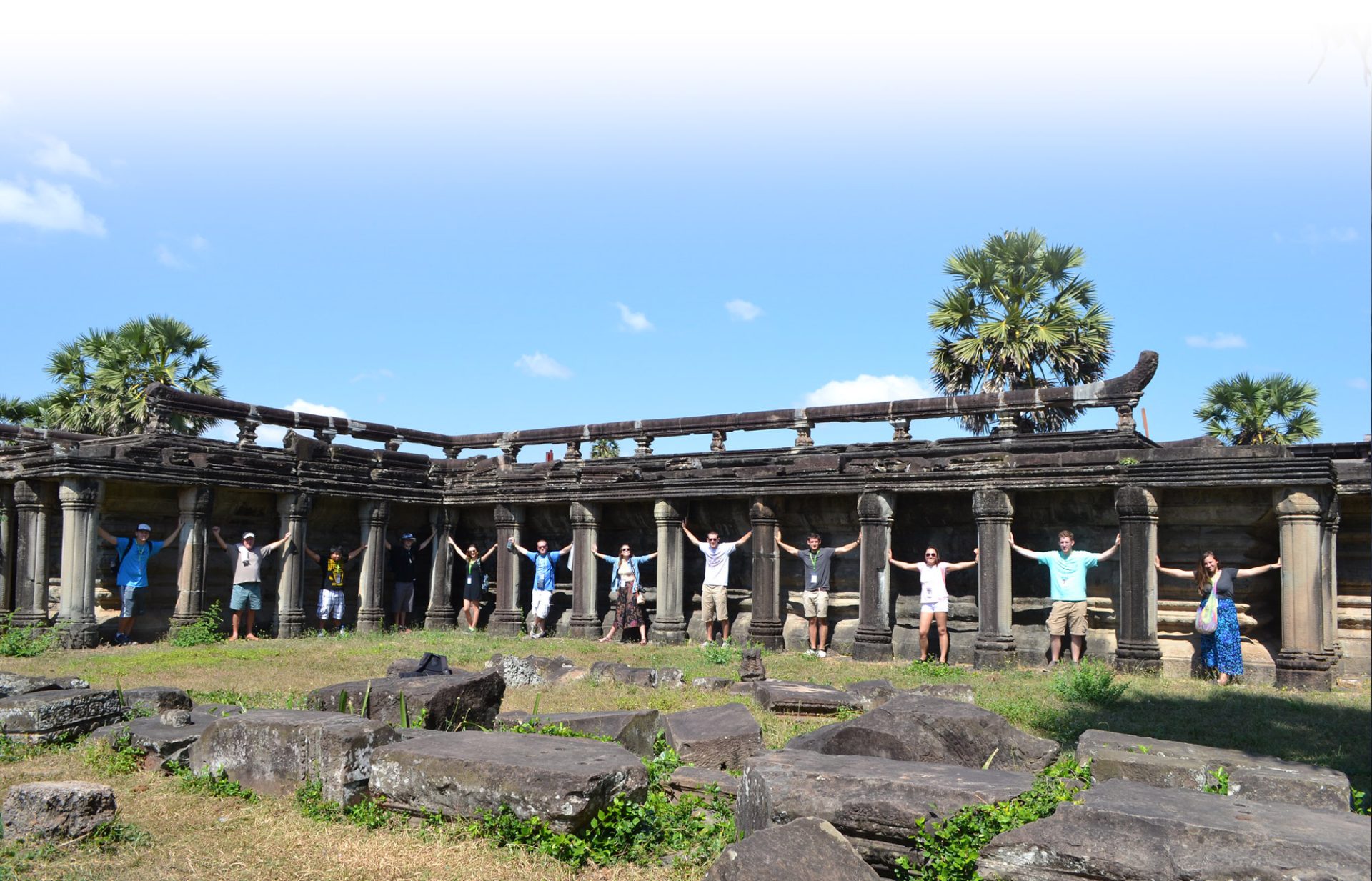 Business management majors stand in the ruins of Angkor Wat