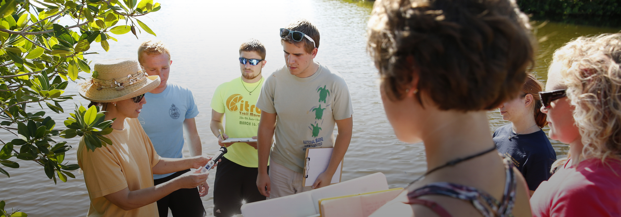 Jeannine Lessmann teaching a class to students in the mangroves