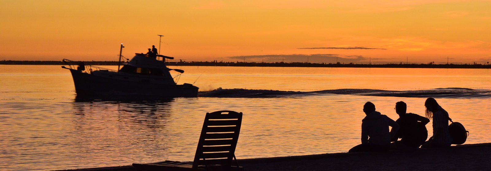 Students playing music on seawall