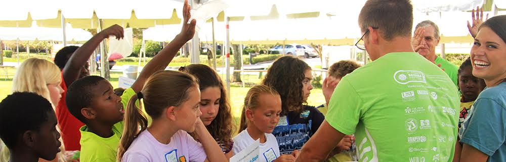 Eckerd students talking to kids at the annual St. Pete Science Festival