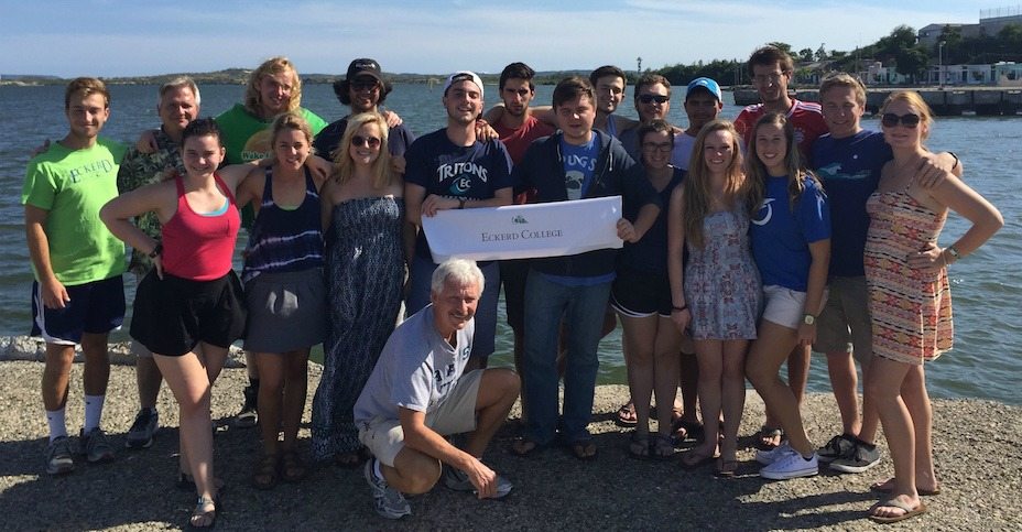 Students pose at Guantanamo Bay during the Winter Term 2015 economics class trip to Cuba