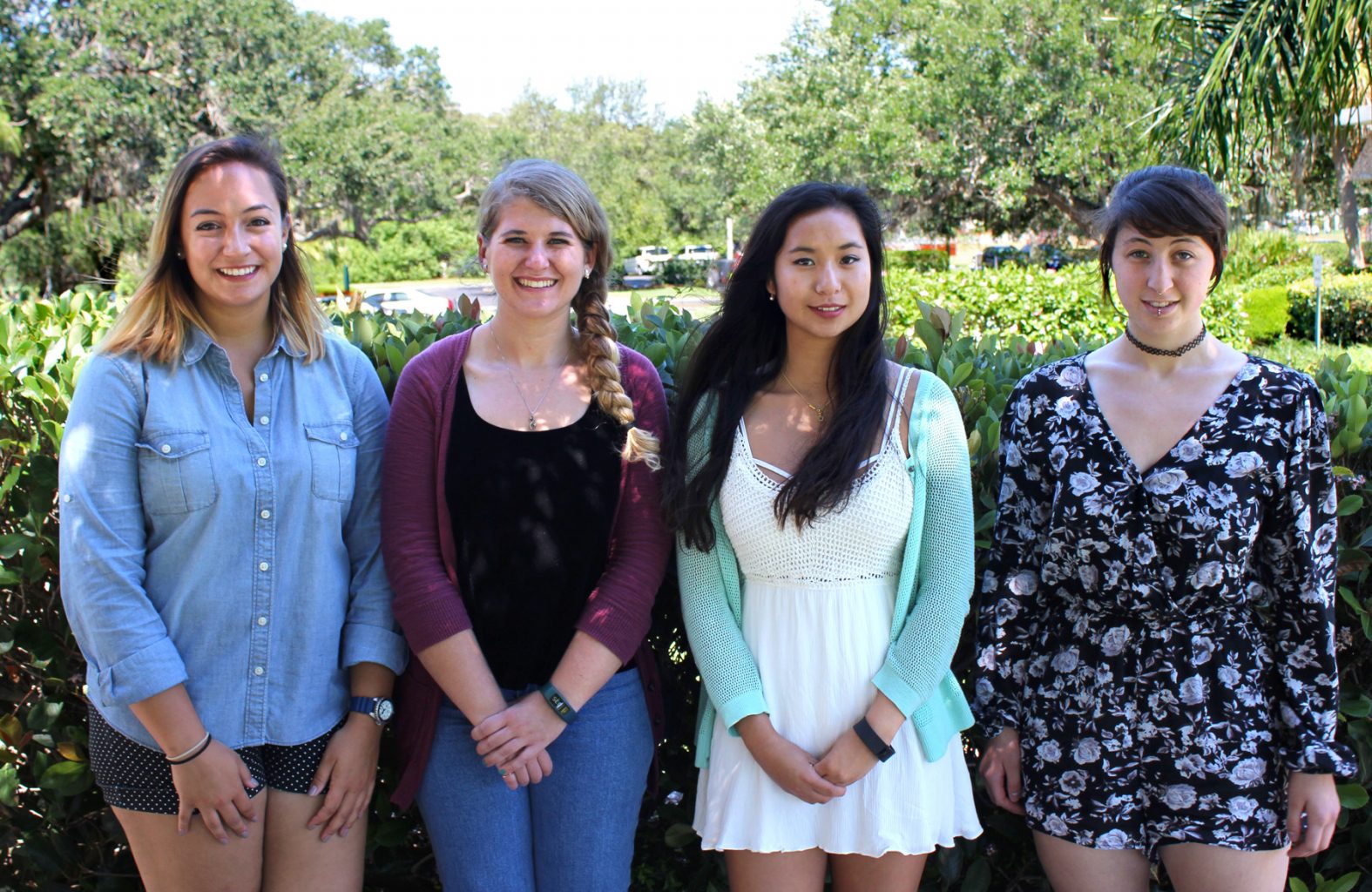 Jessica Heckman, Emily Colson, Lucy Fitzgerald and Abigail Thomas stand outside.