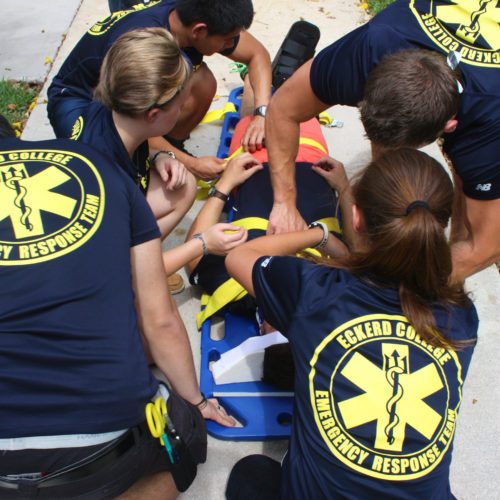 Eckerd College Emergency Response Team members tend to a volunteer during a training simulation.