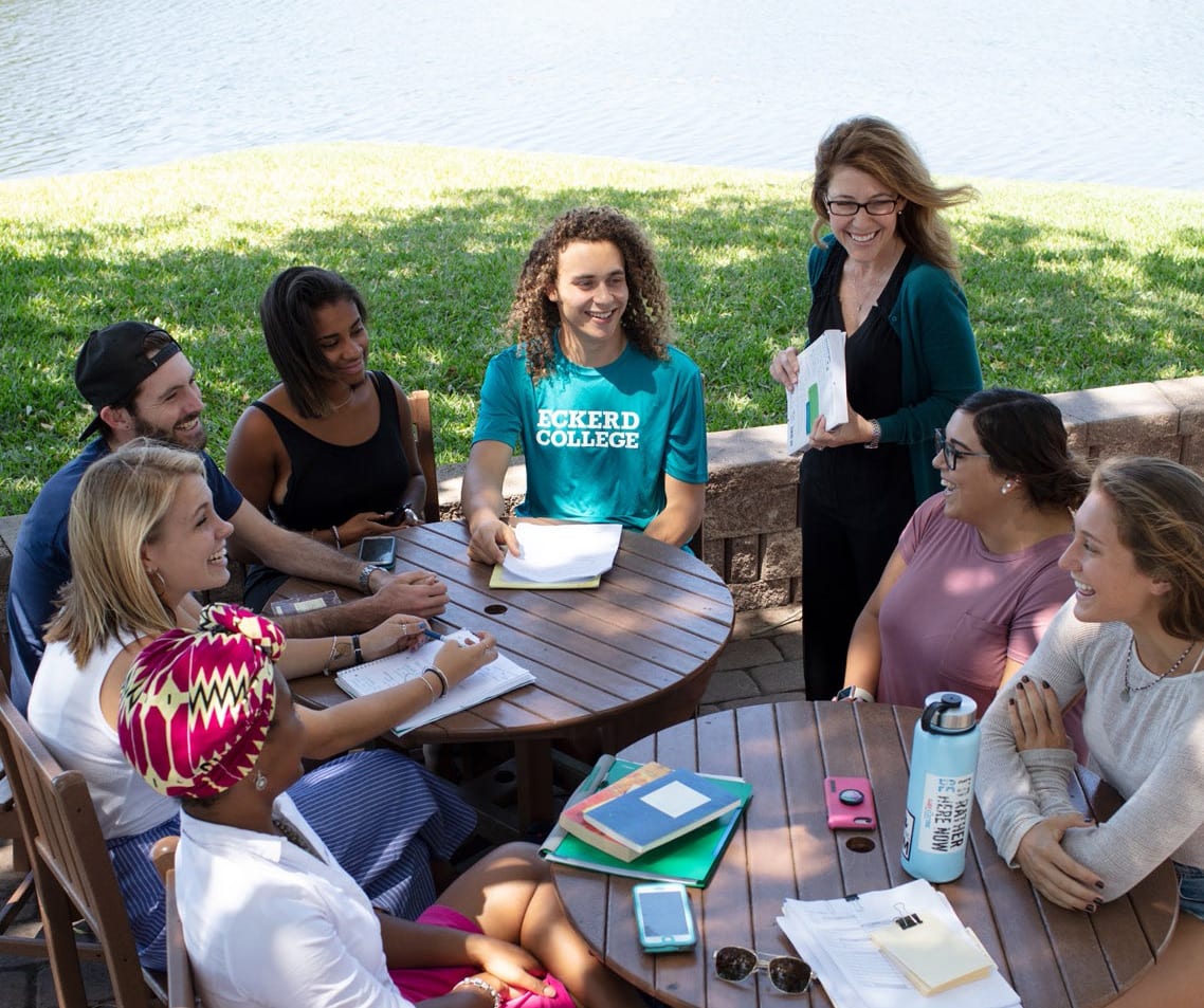 Assistant Professor of Management Jennifer Knippen teaching a group of students