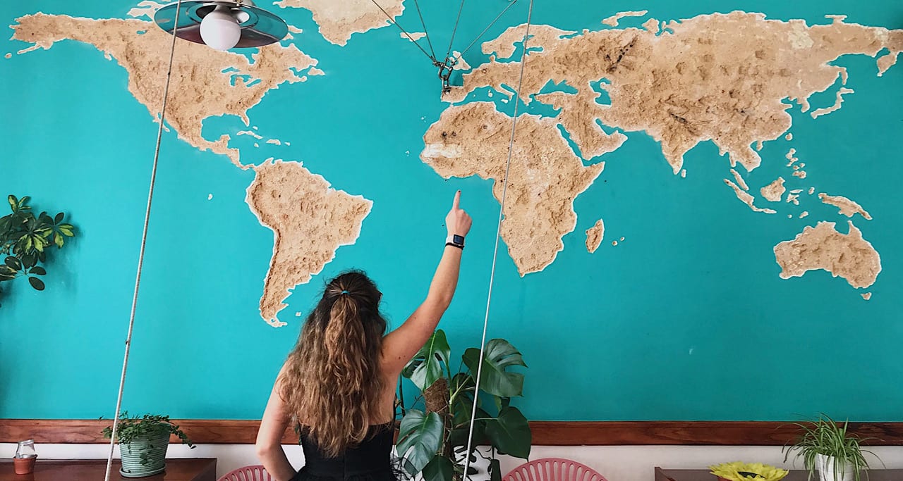 Student looking at a map of the world