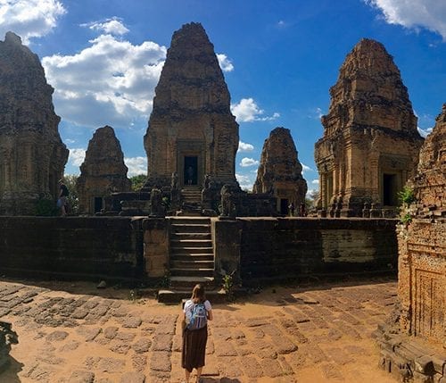 Eckerd student in the middle of the Ta Prohm temple, Angkor Wat