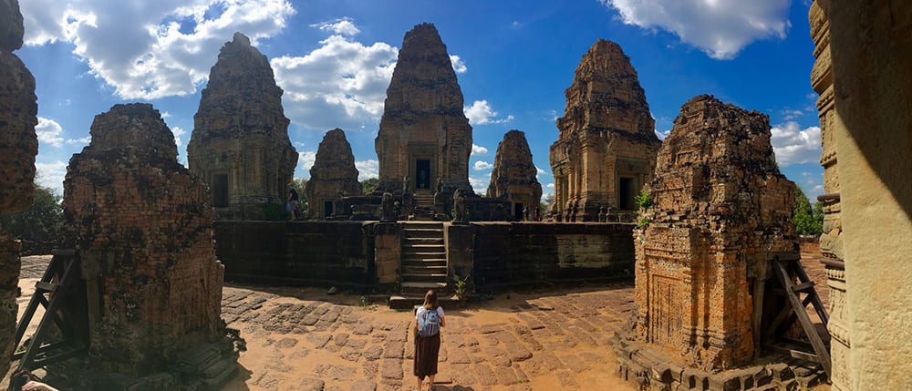 Eckerd student in the middle of the Ta Prohm temple, Angkor Wat