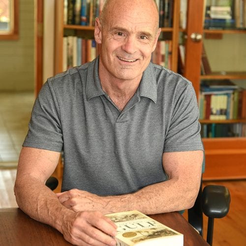 Pulitzer Prize-winning author Jack Davis at table with book