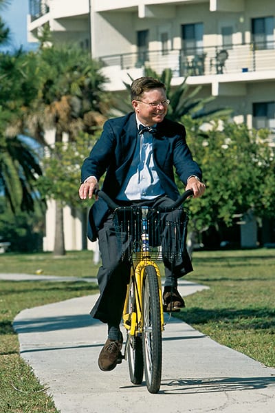 Dr. Eastman on a yellow bike