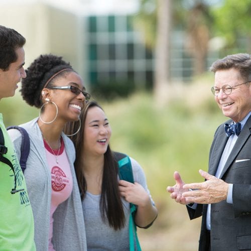 Dr. Eastman laughing with students