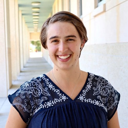 Jennifer Necker next to library