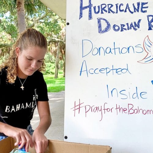 Morgan Bower '22 gathering donations in box