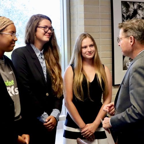 Dr. Eastman talks with representatives of Eckerd College Reduce Single Use and Florida Public Research Interest Group Students.