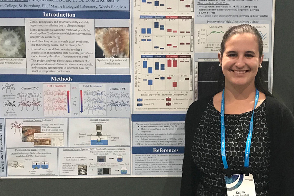 Eckerd College student in front of scientific poster