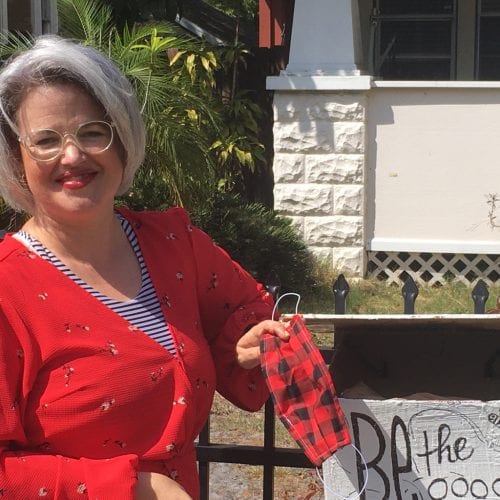 Eckerd College Theatre Professor Jessica Thonen holds a mask