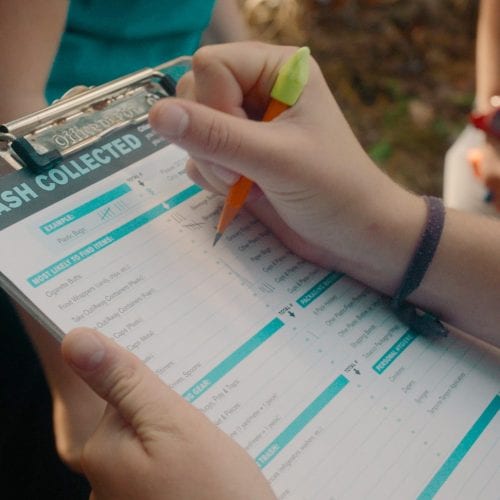 Clipboard showing plastic trash collection data