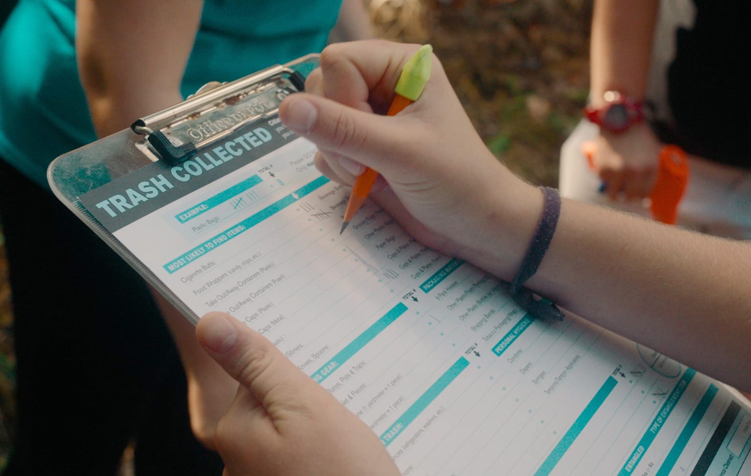 Clipboard showing plastic trash collection data