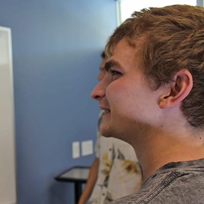 Computer Science student at whiteboard