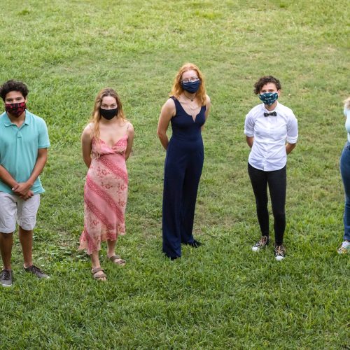 Seven Hollings Scholars from Eckerd College standing in grass