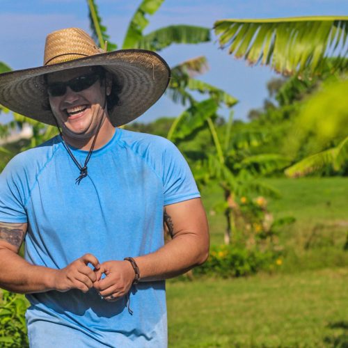 Jonathan Prieto in the Eckerd College community farm