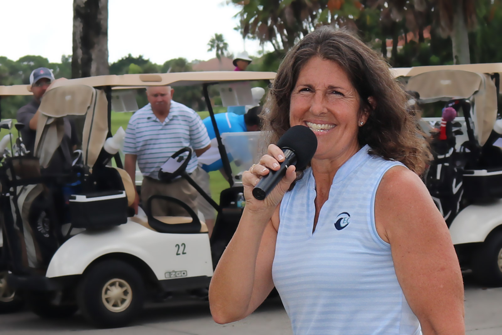 Sue McDermott emcees at memorial golf tournament