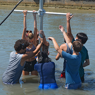 Eckerd College marine science students sample sediment on the seafloor