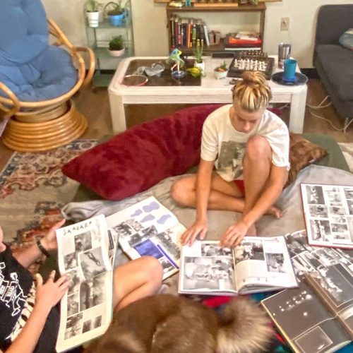 Eckerd students in room poring over old books