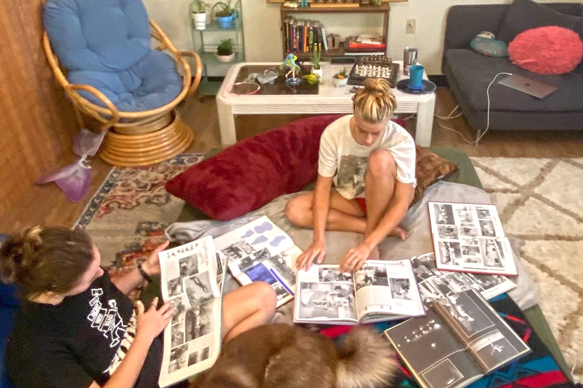 Eckerd students in room poring over old books