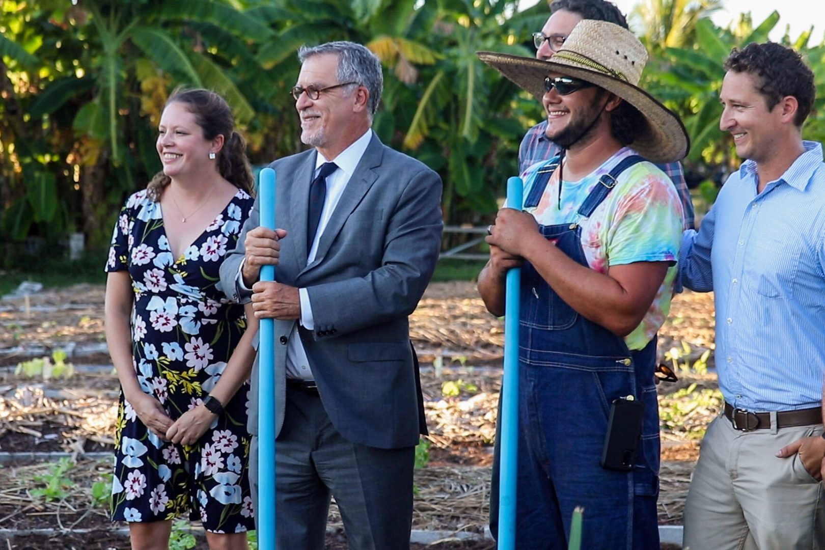 President Fernandez and Farmer Jon holding shovels