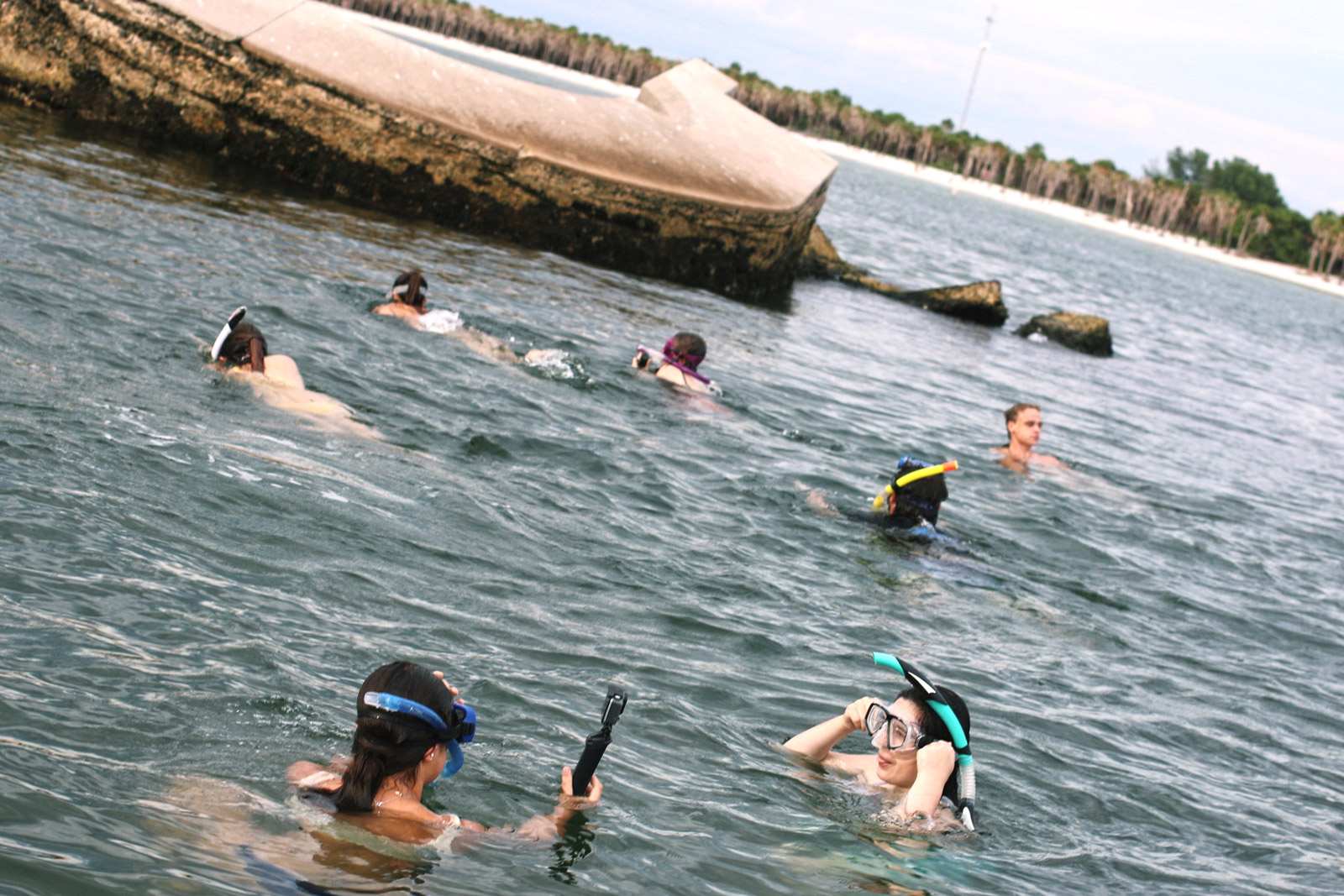 Eckerd College students snorkeling in the water